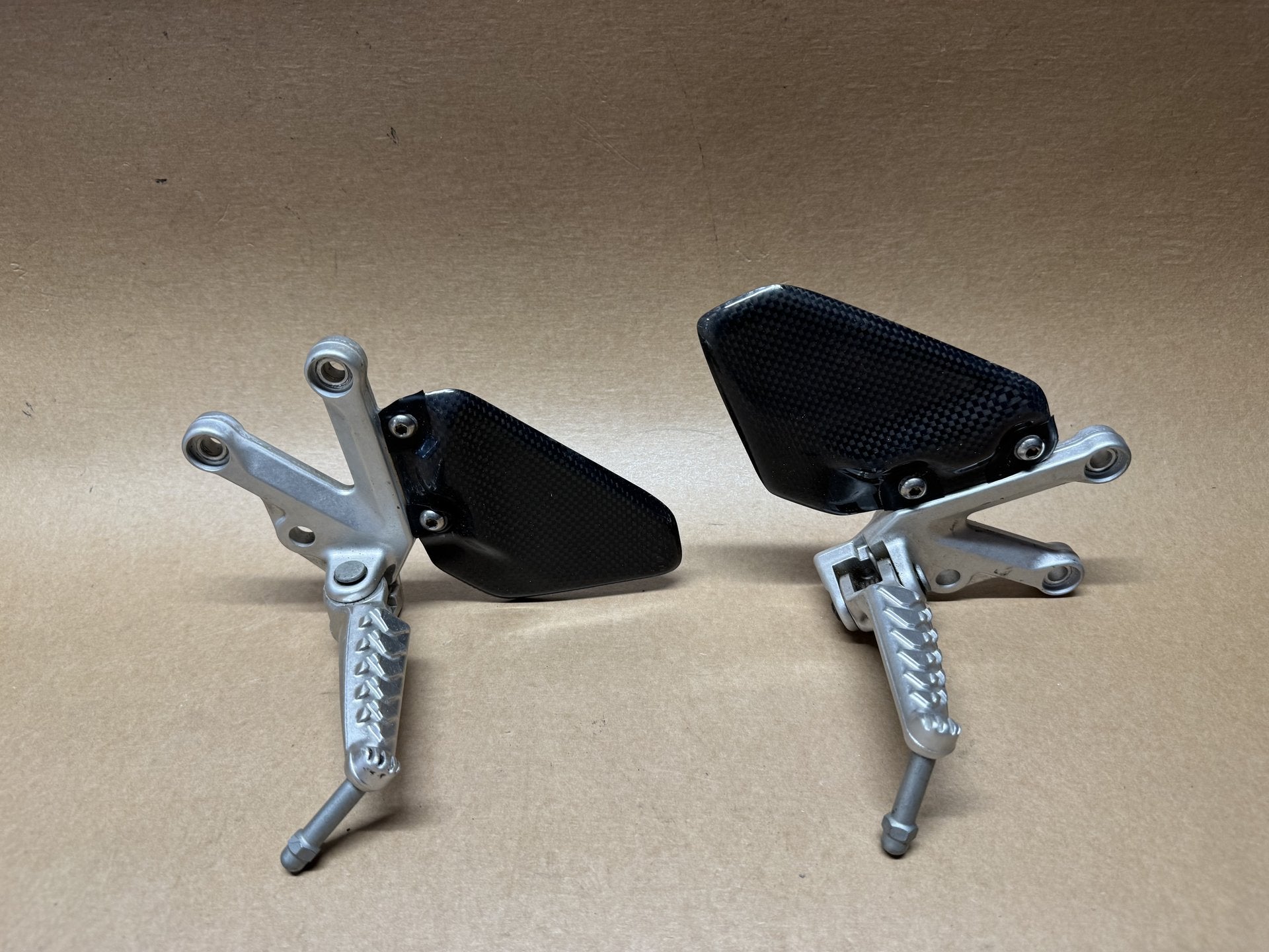 OEM front foot peg hangers for Aprilia RSV 1000 2004-2010