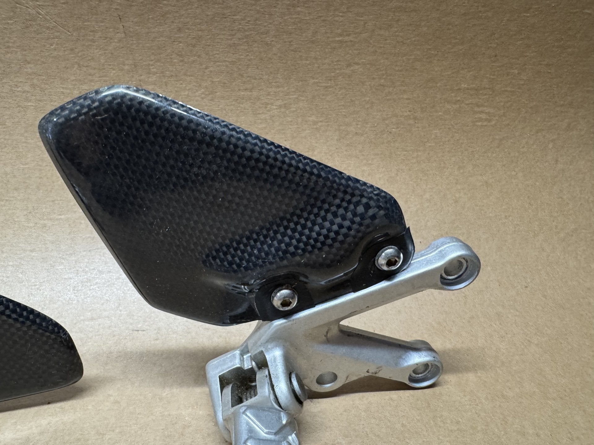 OEM front foot peg hangers for Aprilia RSV 1000 2004-2010
