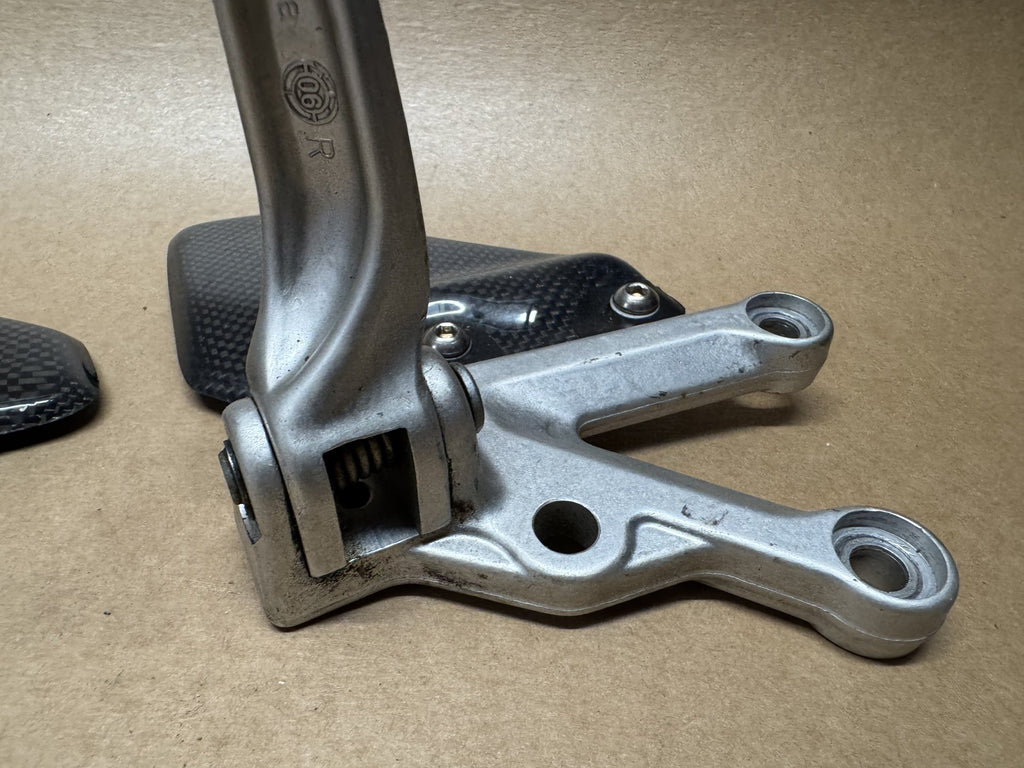 OEM front foot peg hangers for Aprilia RSV 1000 2004-2010
